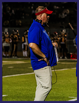 Football coach speaking to the team